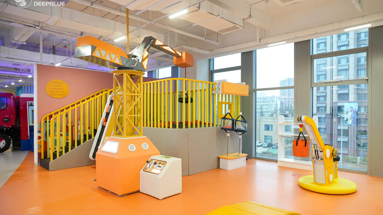 Completed architecture learning gallery inside DEEPBLUE's XPLOPLO children's exploration museum, with custom structures and interactive exhibits