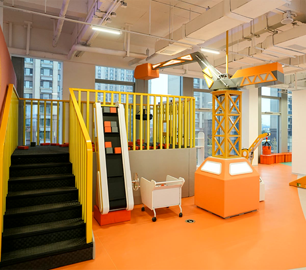Children architecture studio with a construction crane exhibit