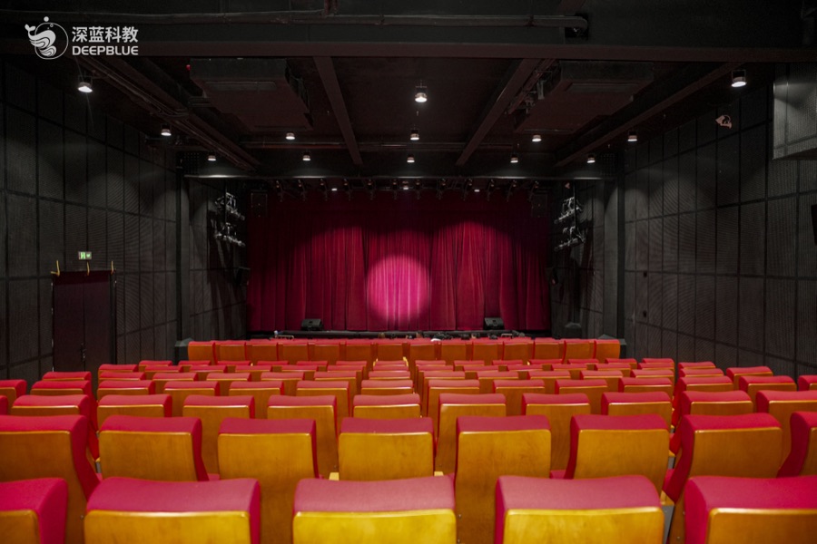 XPLOPLO first-floor WOW auditorium space with red seating XPLOPLO first-floor WOW auditorium space with red seating