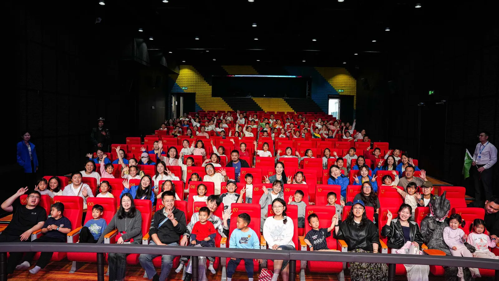 Children and parents taking a group photo in the XPLOPLO WOW Auditorium Children and parents taking a group photo in the XPLOPLO WOW Auditorium